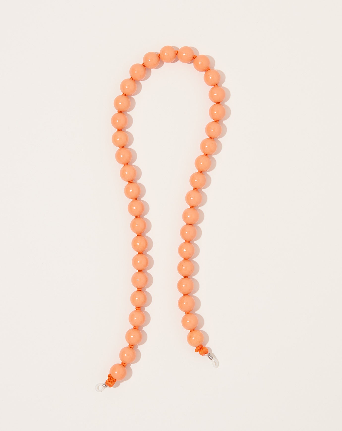 Ina Seifart Brillenkette Big Eyeglass Chain in Peach on Orange