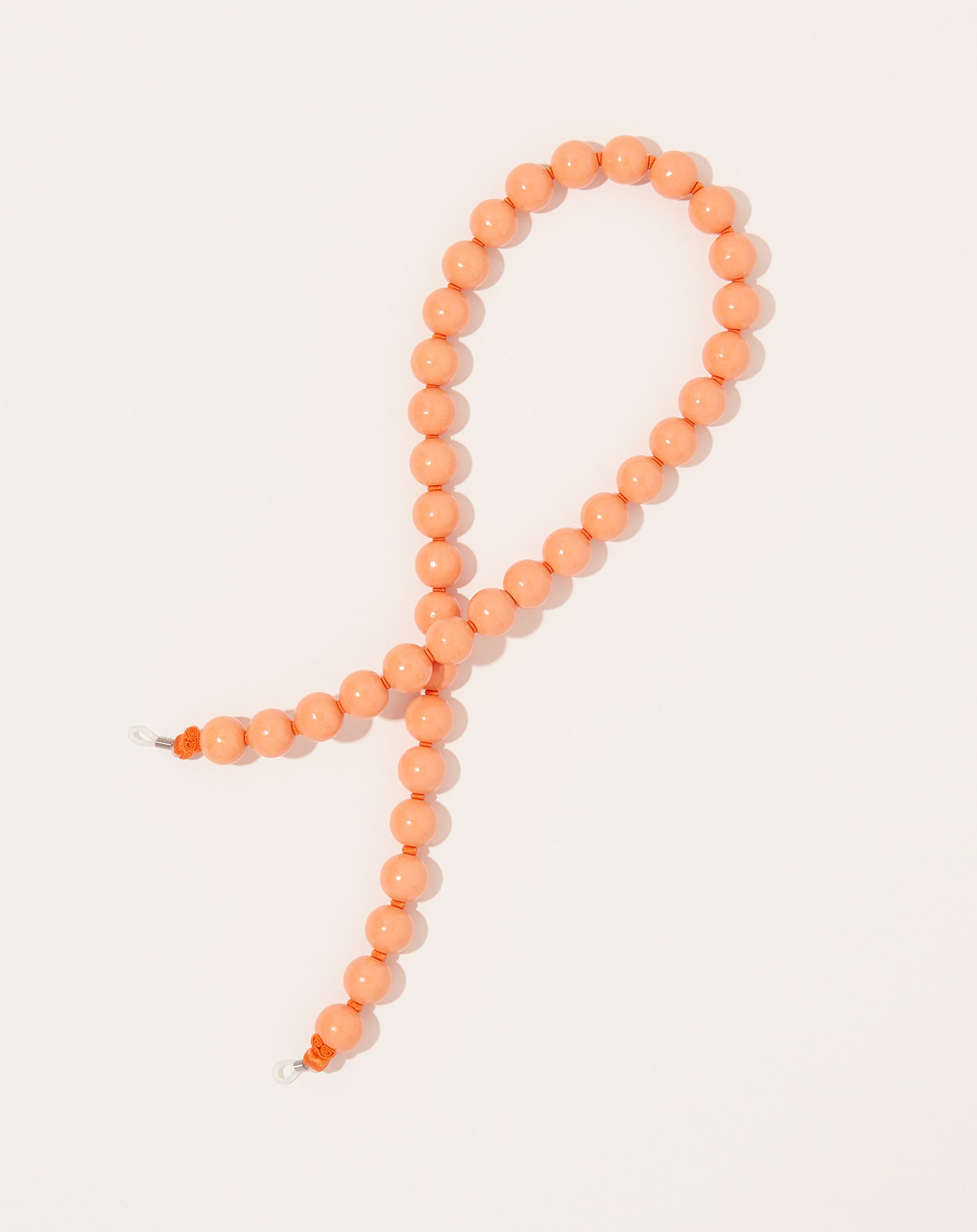 Ina Seifart Brillenkette Big Eyeglass Chain in Peach on Orange