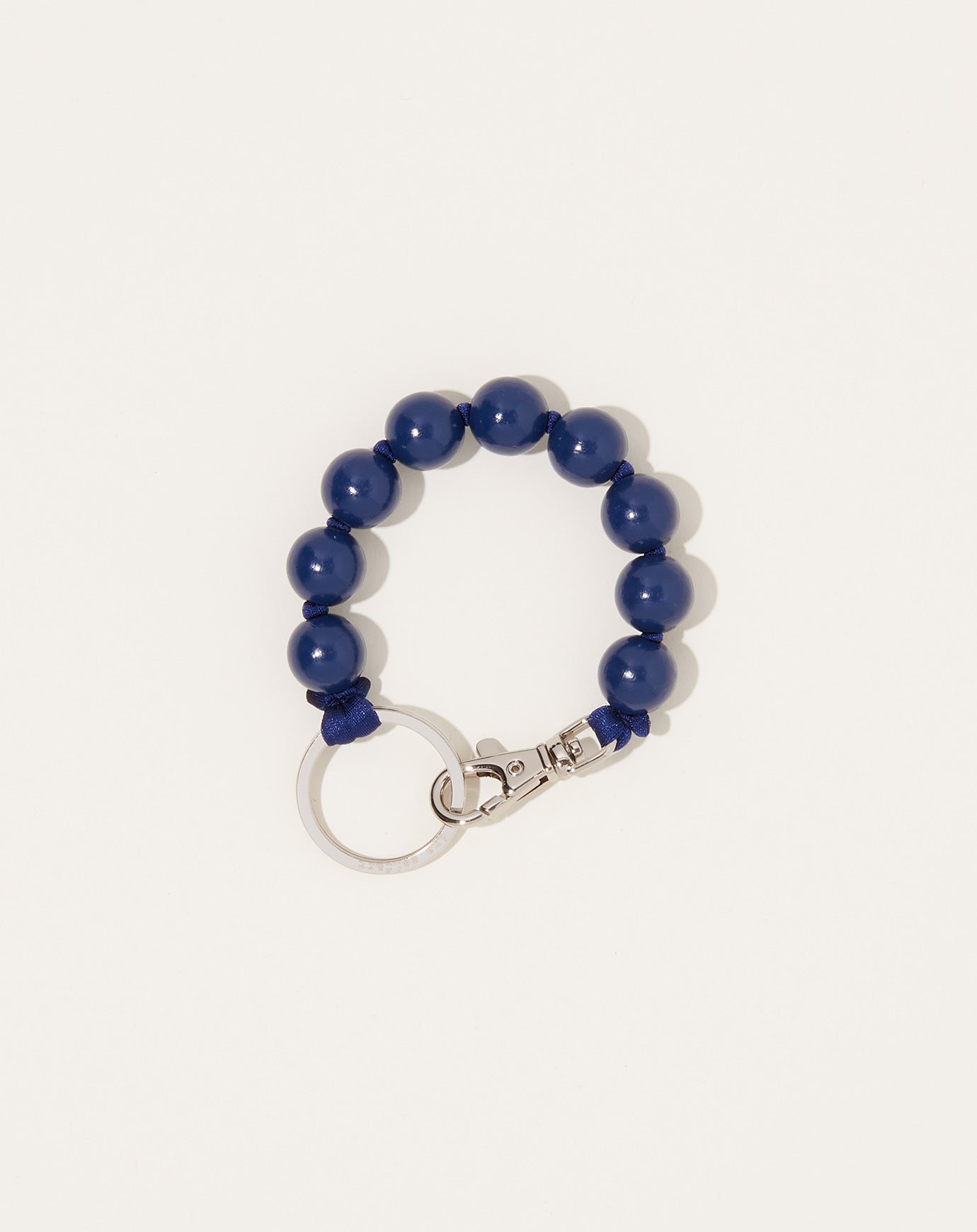 Ina Seifart Big Perlen Short Keyholder in Blueberry on Dark Blue