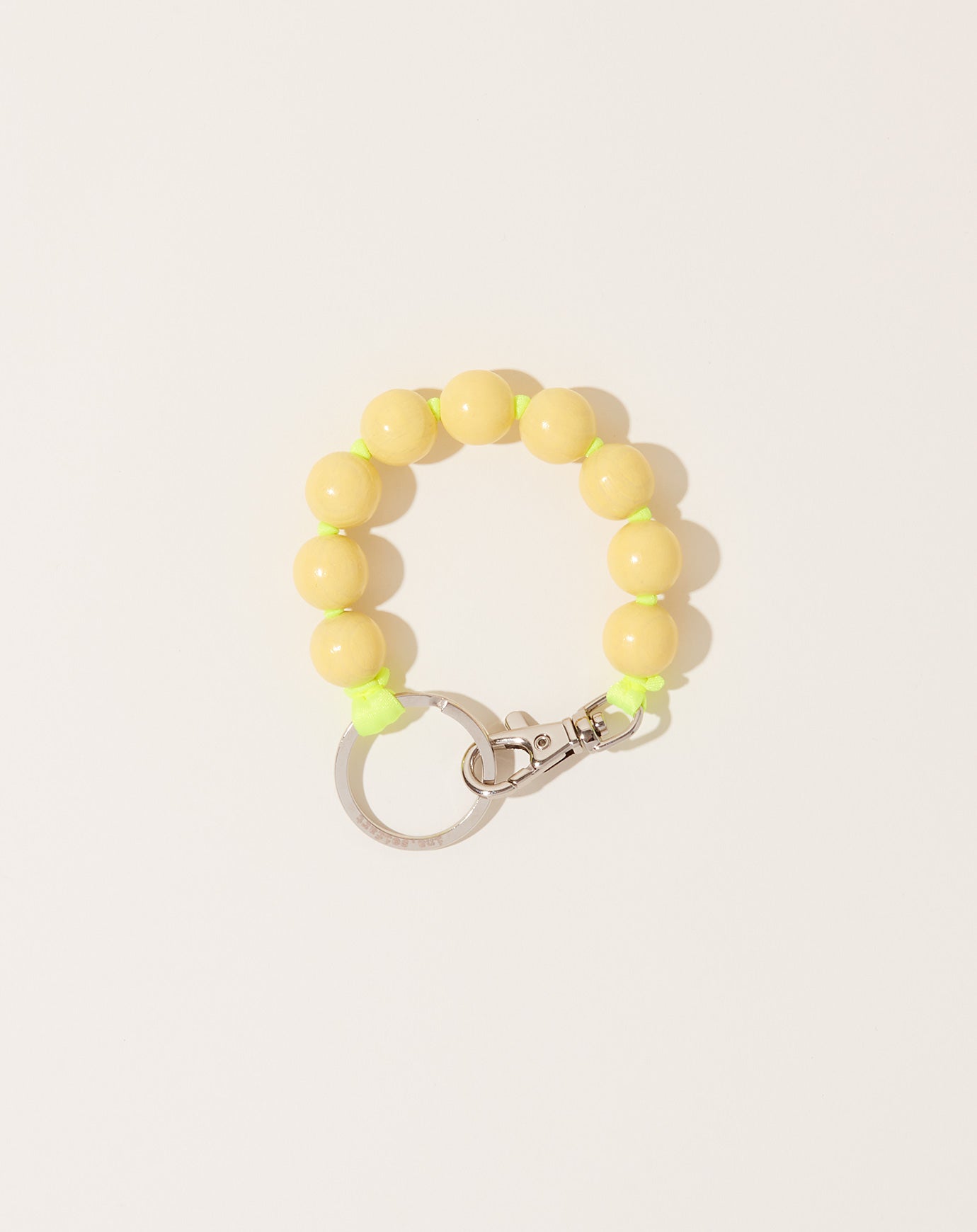 Ina Seifart Big Perlen Short Keyholder in Pastel Yellow on Neon Yellow