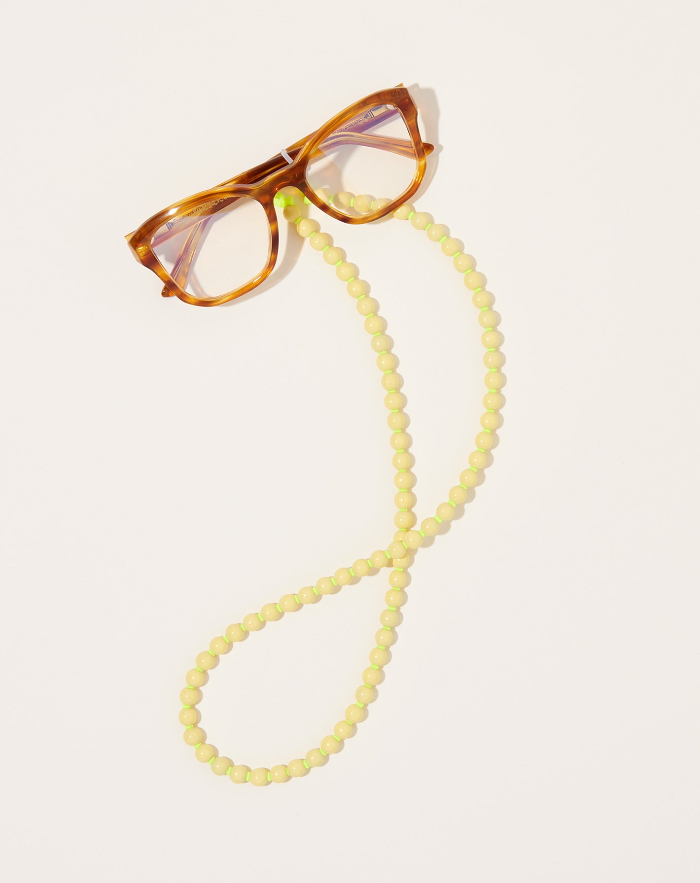 Ina Seifart Brillenkette Eyeglass Chain in Pastel Yellow on Neon Yellow