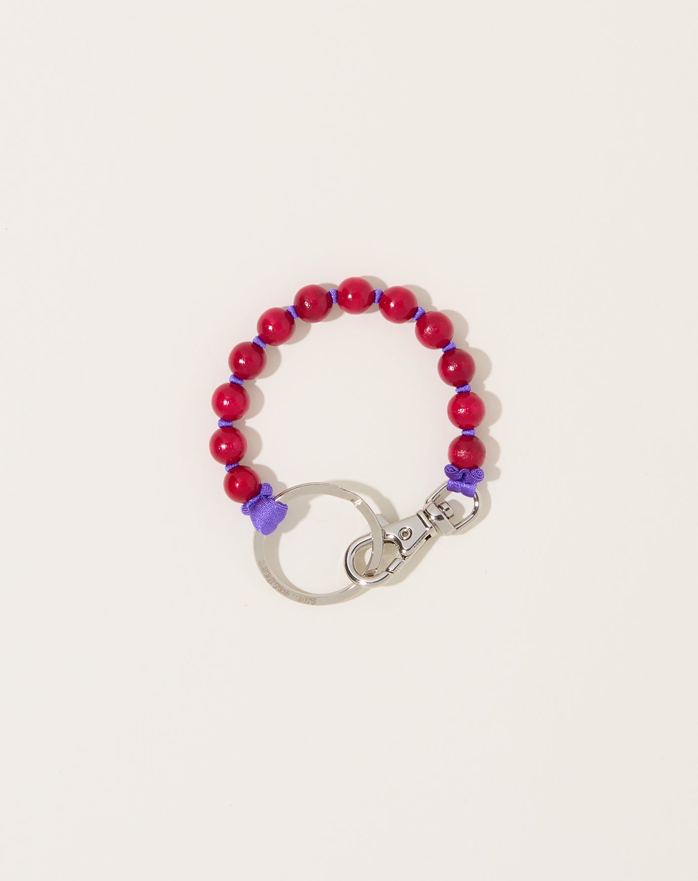 Ina Seifart Perlen Short Keyholder in Dark Pink on Purple