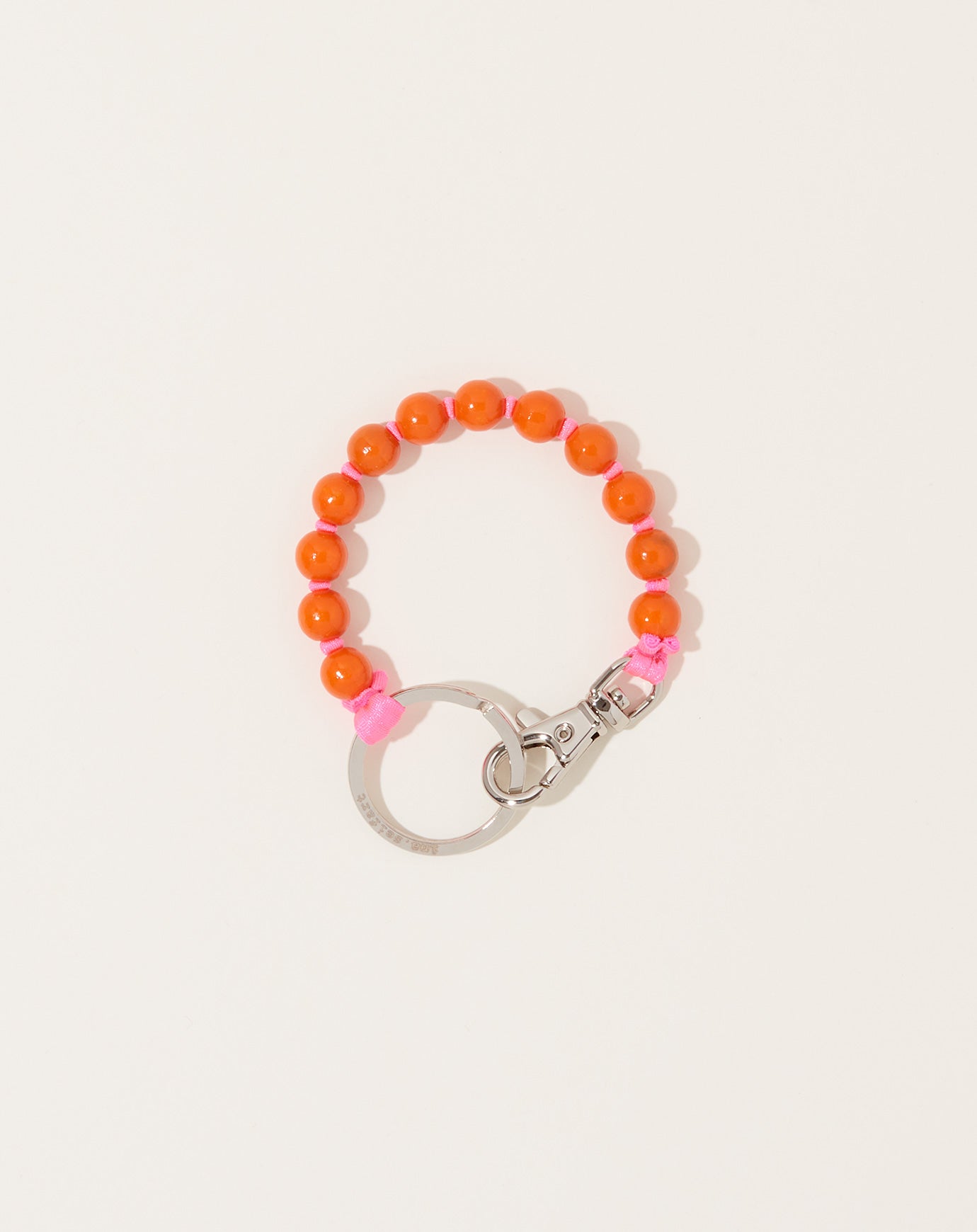 Ina Seifart Perlen Short Keyholder in Orange on Neon Pink