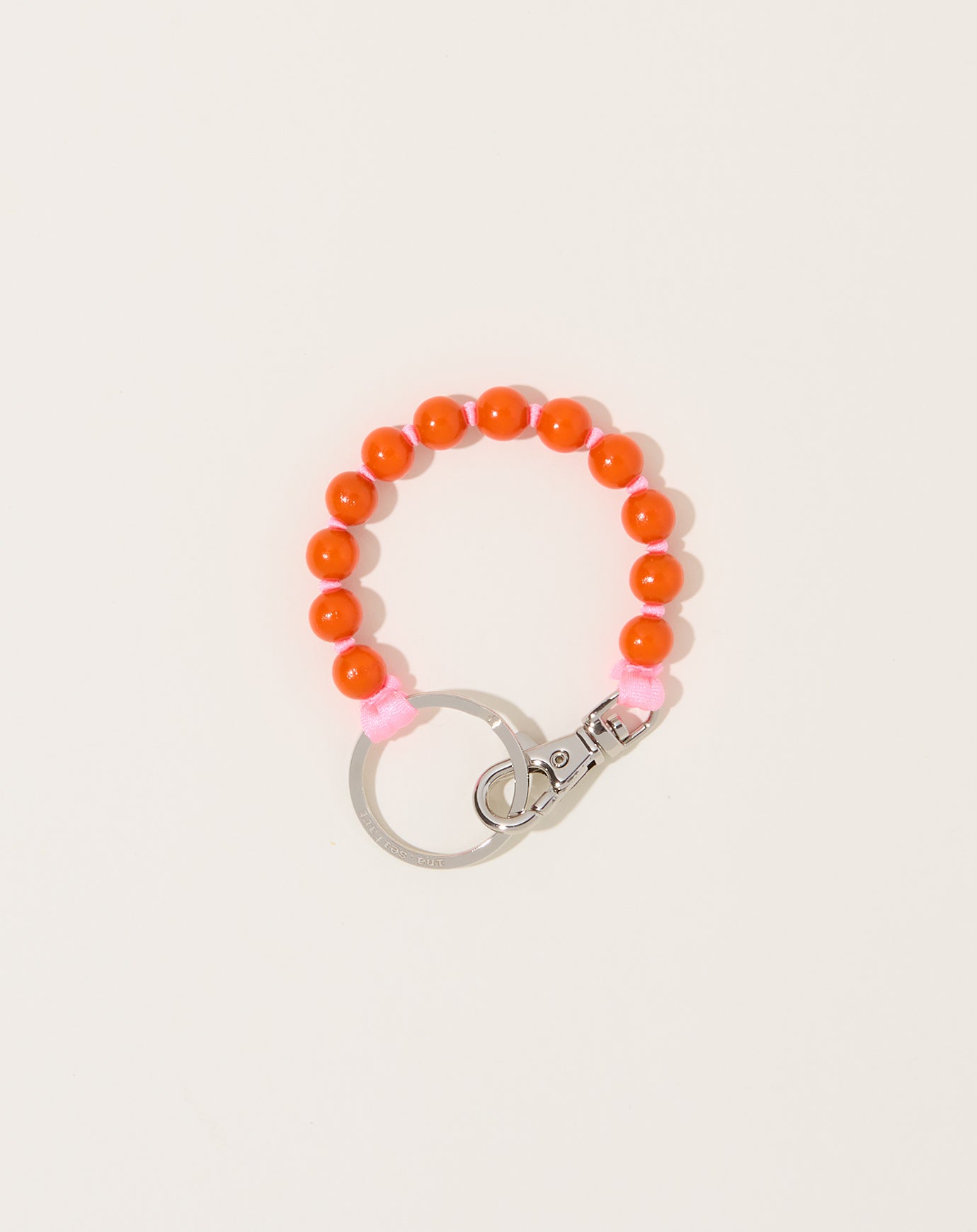 Ina Seifart Perlen Short Keyholder in Orange on Rose