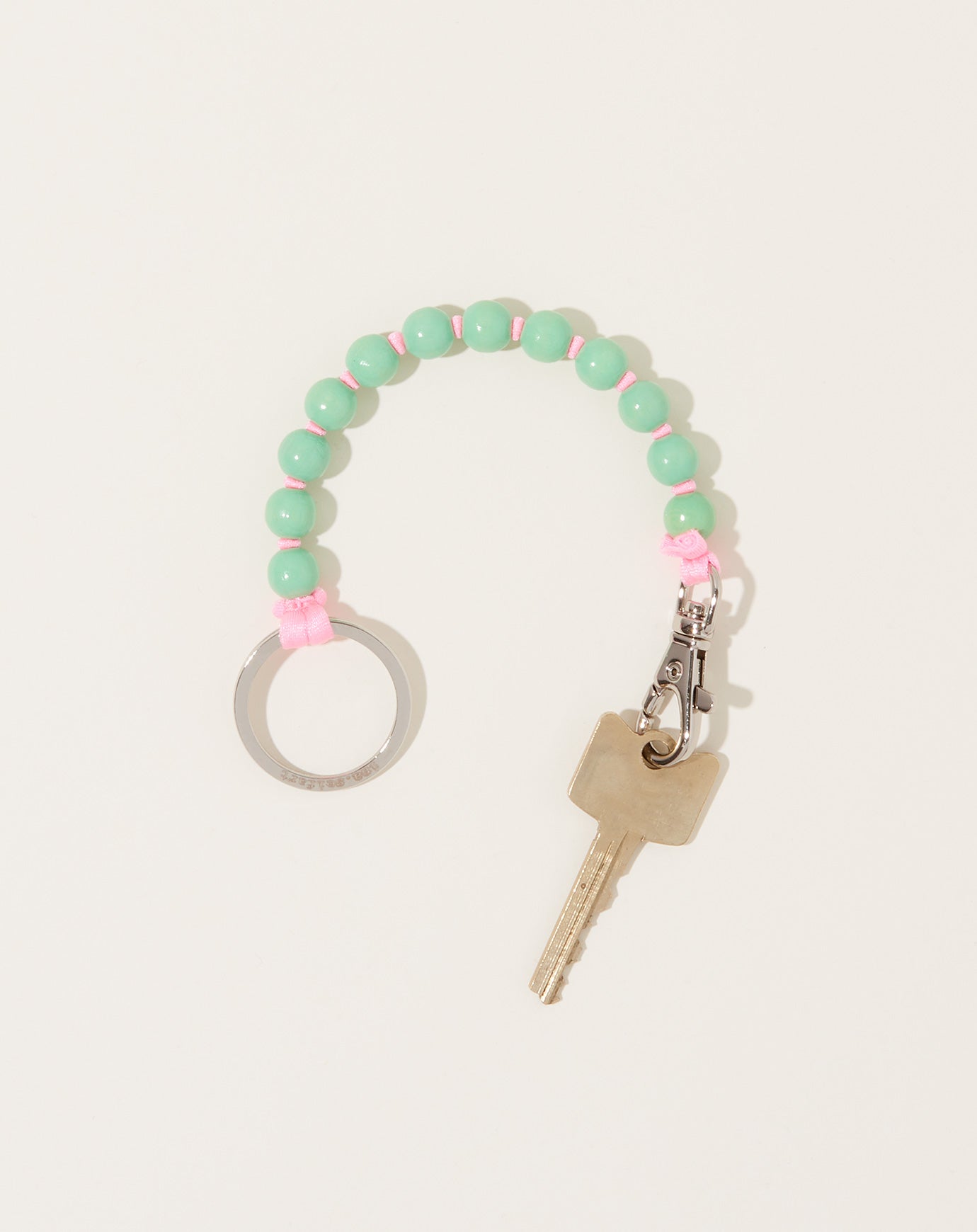 Ina Seifart Perlen Short Keyholder in Pastel Green on Rose