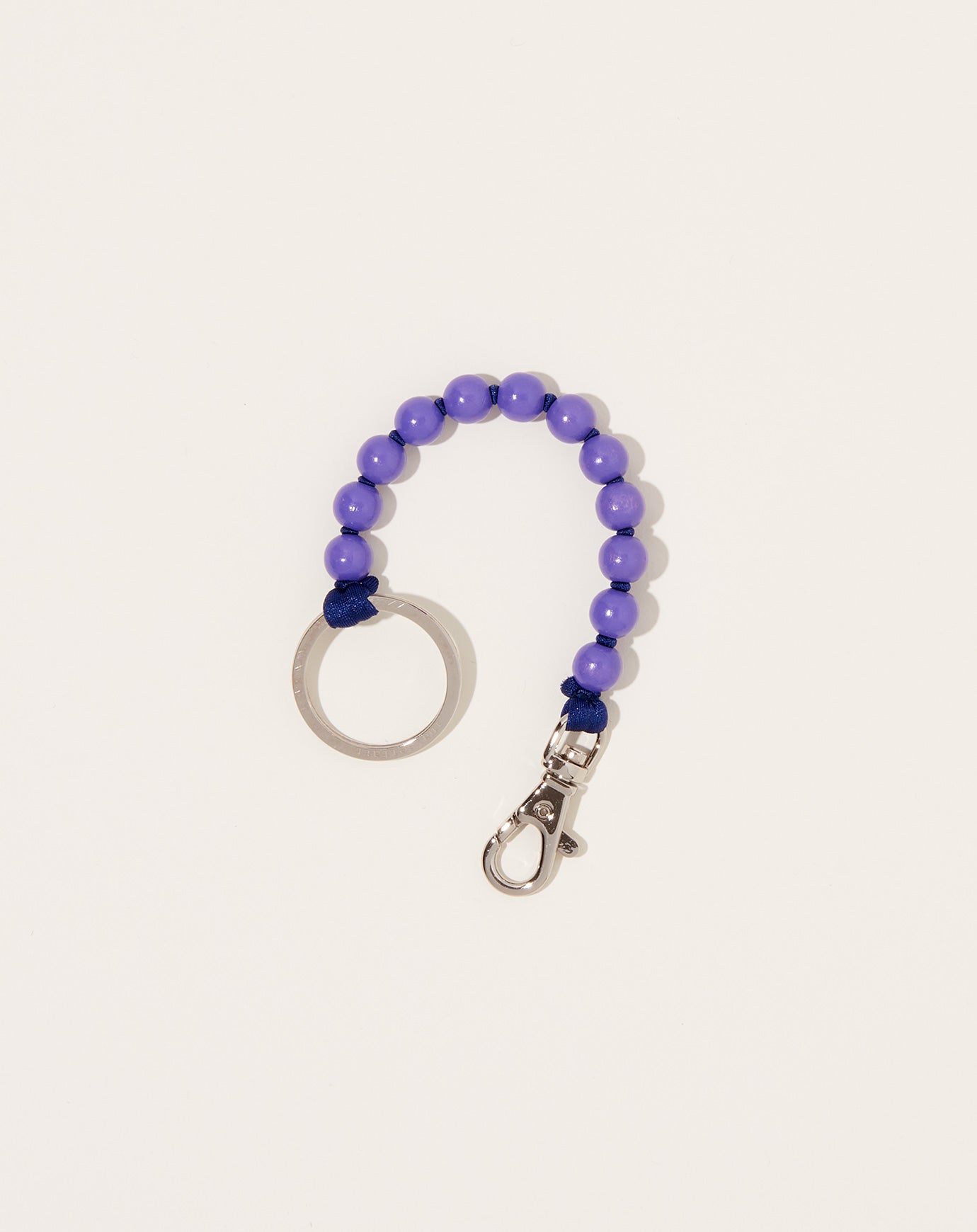 Ina Seifart Perlen Short Keyholder in Purple on Dark Blue