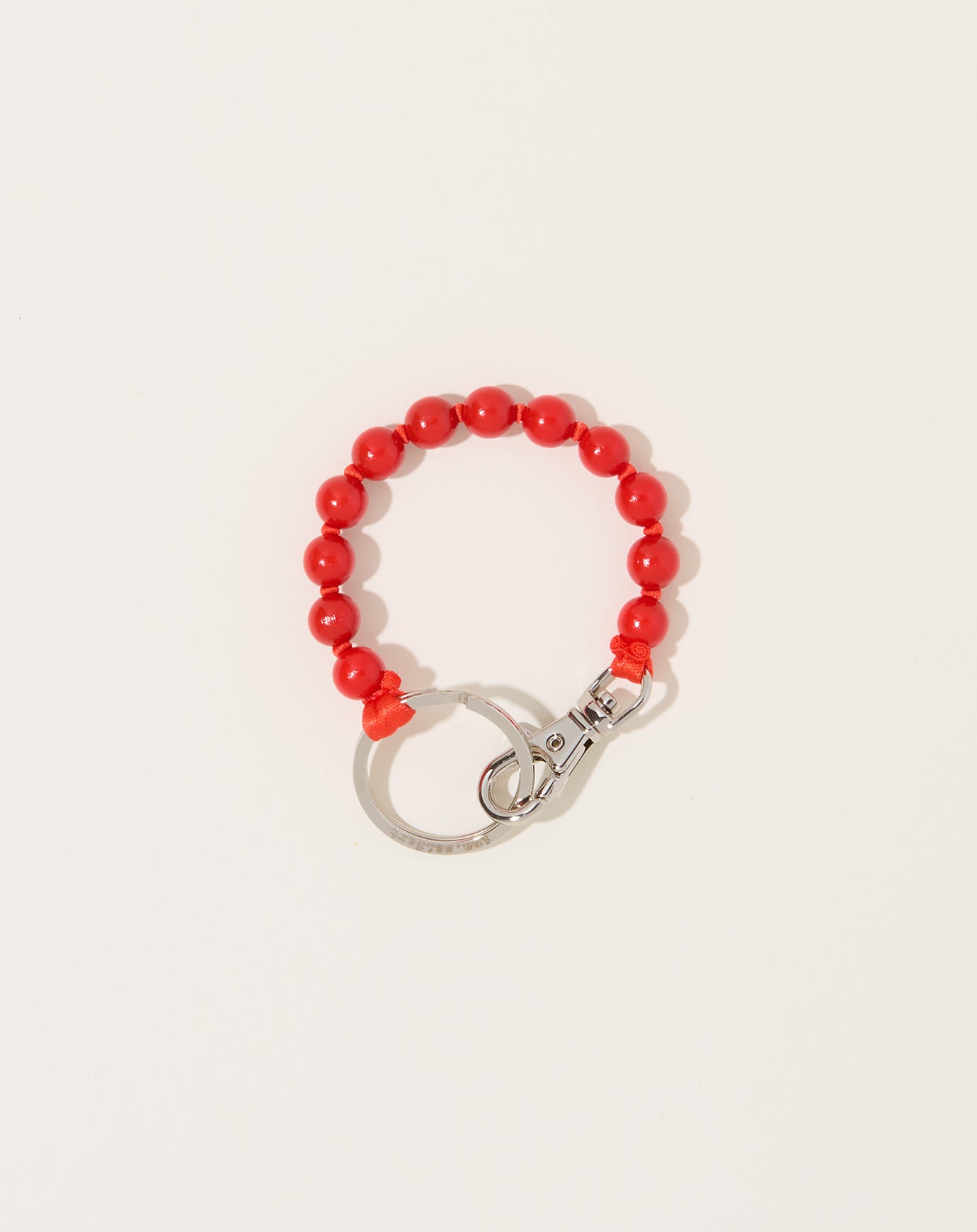 Ina Seifart Perlen Short Keyholder in Red on Pink