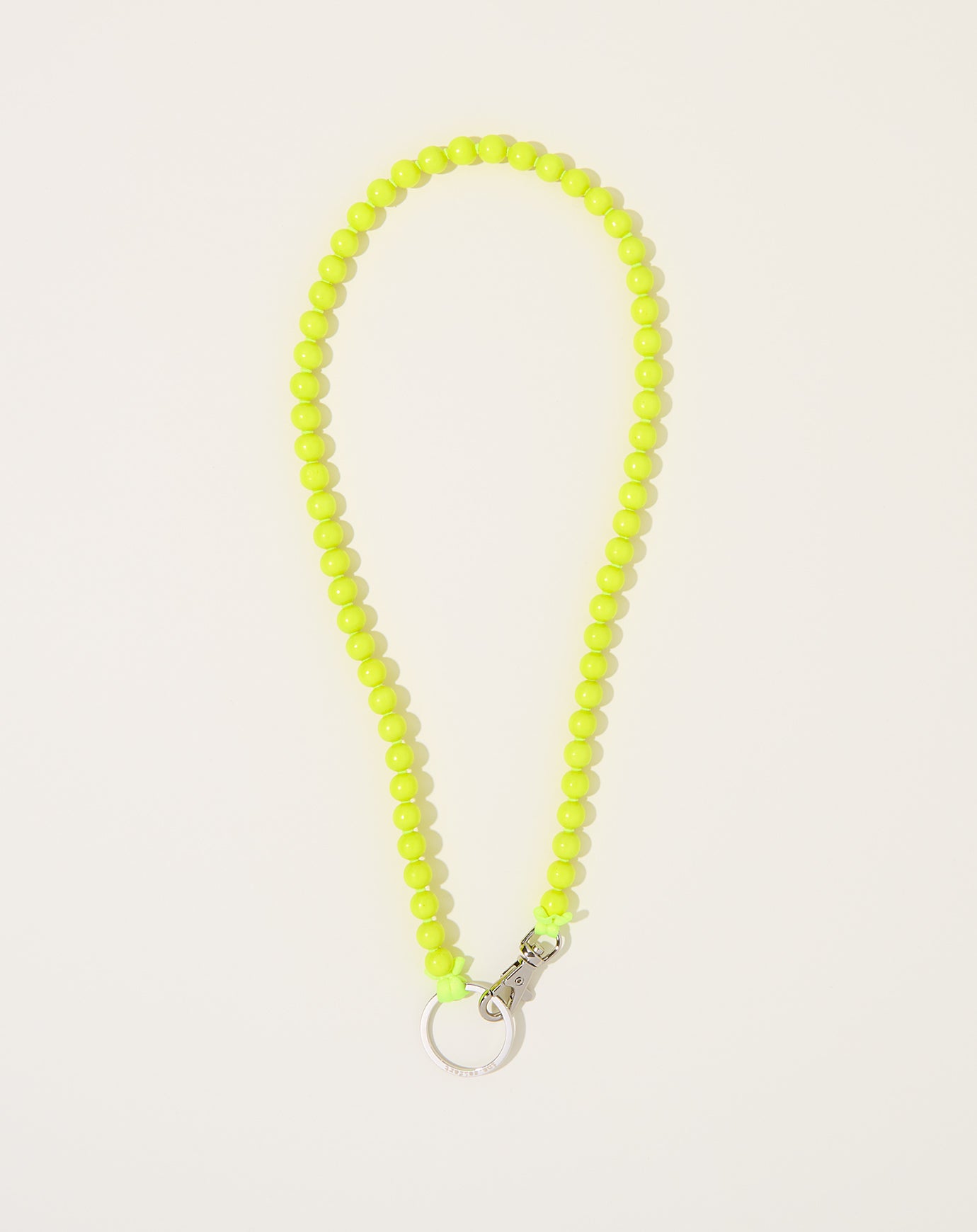 Ina Seifart Perlen Long Keyholder in Yellow on Neon Yellow