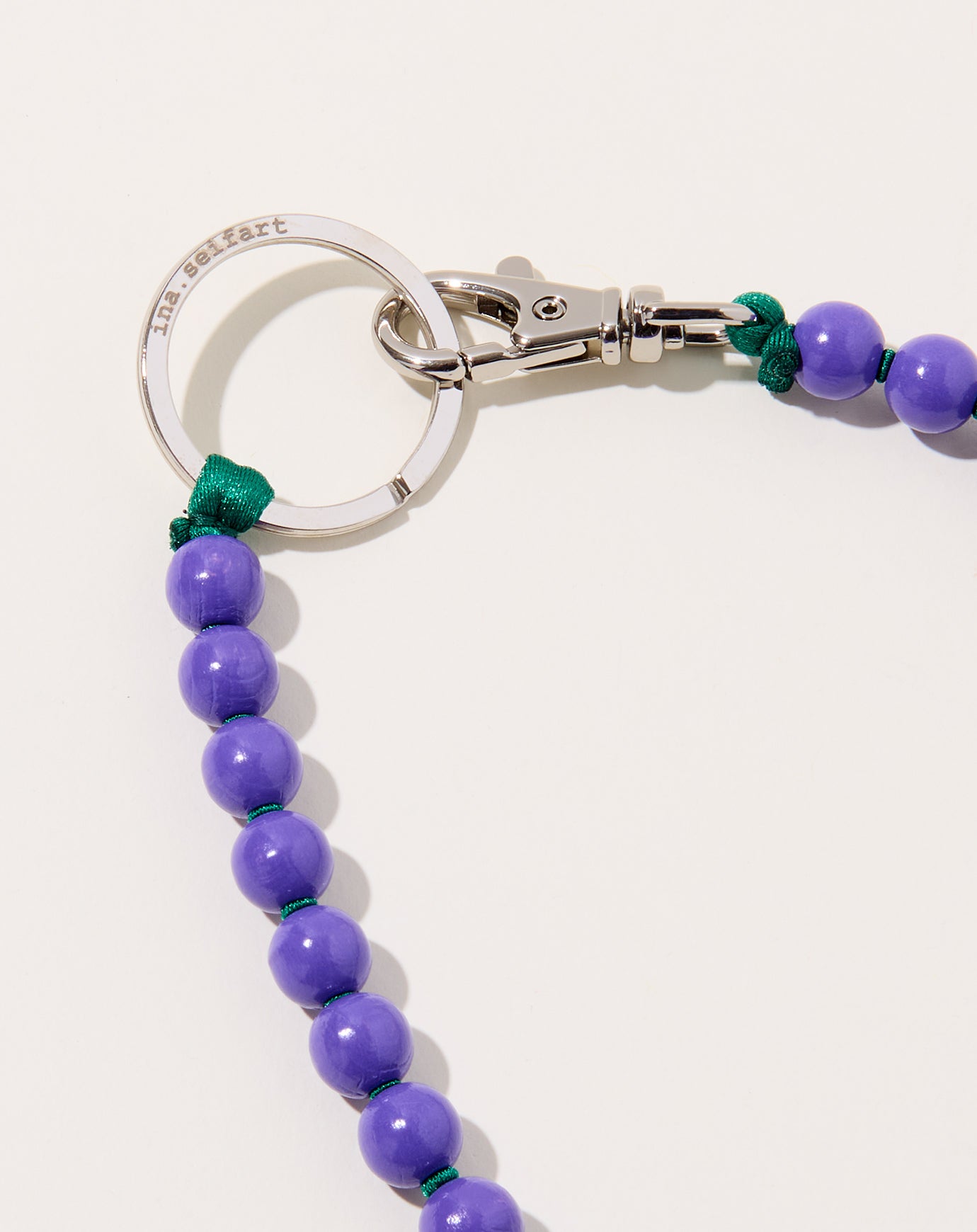 Ina Seifart Perlen Long Keyholder in Purple on Green