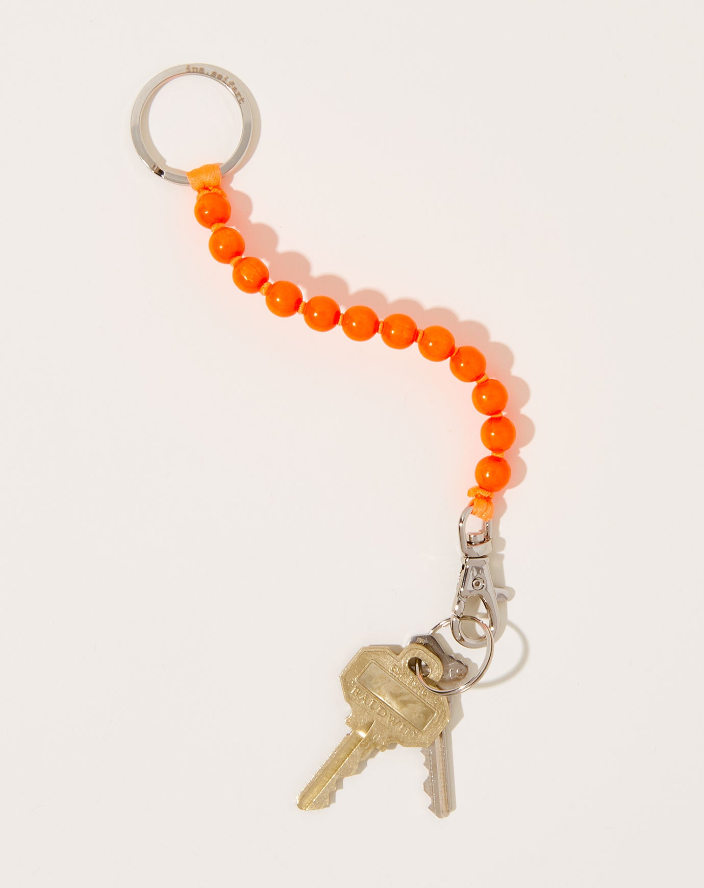 Ina Seifart Perlen Short Keyholder in Neon Orange